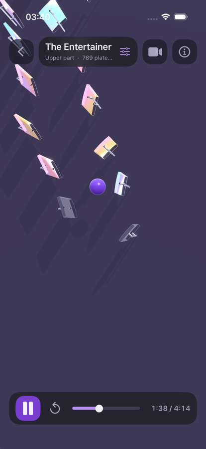MusicBall running on iPhone: a purple ball descending through a wall of coloured plates